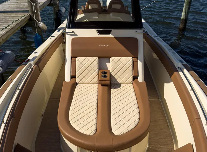 Rest Assured Yacht Photos Pics Luxurious 2019 Chris-Craft 30 Catalina boat interior with elegant seating and water view.