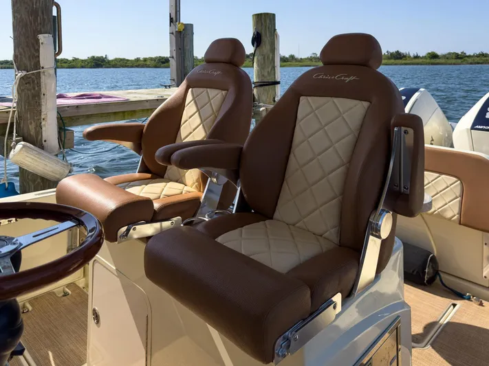 Rest Assured Yacht Photos Pics Luxurious seating on 2019 Chris-Craft 30 Catalina boat, featuring elegant diamond-stitched upholstery.