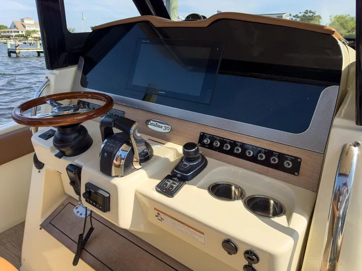 Rest Assured Yacht Photos Pics 2019 Chris-Craft 30 Catalina helm with modern controls and wooden steering wheel.