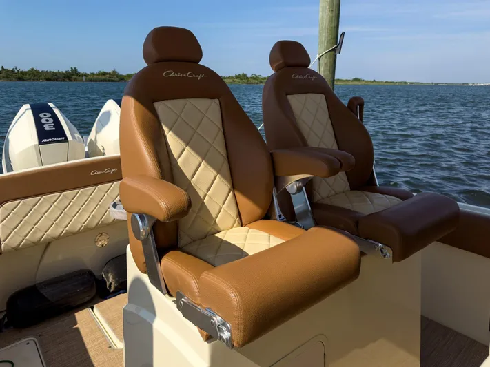 Rest Assured Yacht Photos Pics 2019 Chris-Craft 30 Catalina boat seats with luxurious brown and cream upholstery.