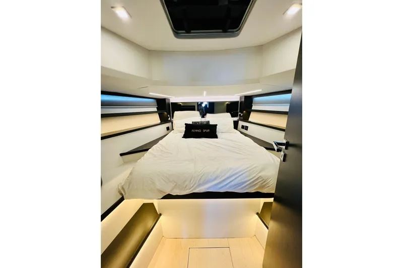 Gustavia I Yacht Photos Pics Luxurious bedroom interior of 2021 OKEAN 55 yacht with modern design and ambient lighting.
