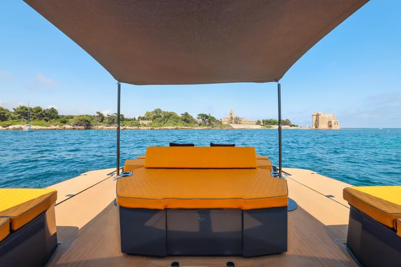 Gustavia I Yacht Photos Pics Luxury OKEAN 55 yacht deck with sunshade, overlooking scenic coastal view, 2021 model.