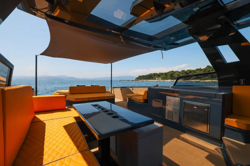 Gustavia I Yacht Photos Pics Luxurious 2021 OKEAN 55 yacht interior with modern seating and ocean view.