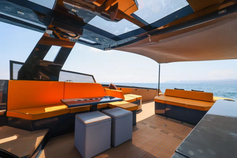 Gustavia I Yacht Photos Pics Luxurious 2021 OKEAN 55 yacht interior with modern seating and ocean view.
