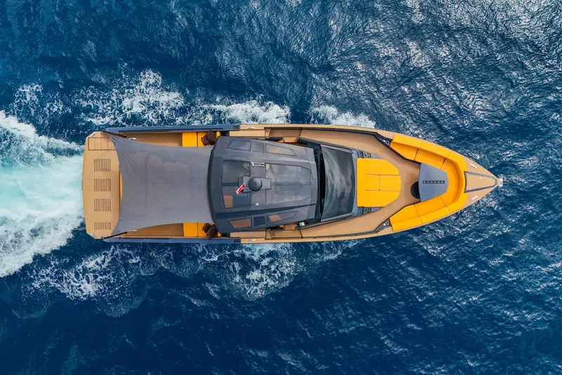 Gustavia I Yacht Photos Pics Aerial view of 2021 OKEAN 55 yacht cruising on blue ocean waters.