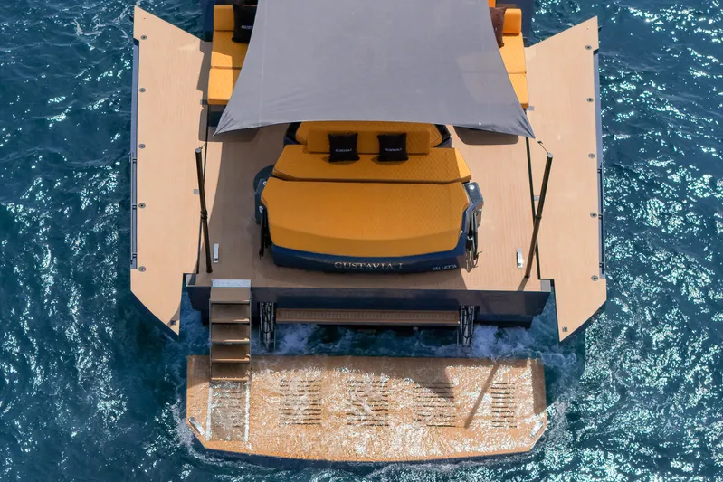 Gustavia I Yacht Photos Pics Aerial view of 2021 OKEAN 55 yacht with sun deck and canopy on blue water.