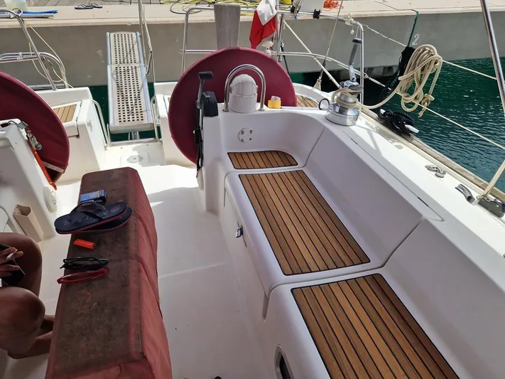  Yacht Photos Pics Cockpit of 2001 Beneteau Oceanis 473 Clipper with teak seating and nautical equipment.
