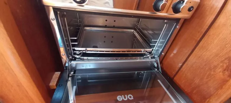 Happy Destiny Yacht Photos Pics Oven inside Jeanneau Sun Odyssey 43 DS yacht, 2004 model, with wooden interior.