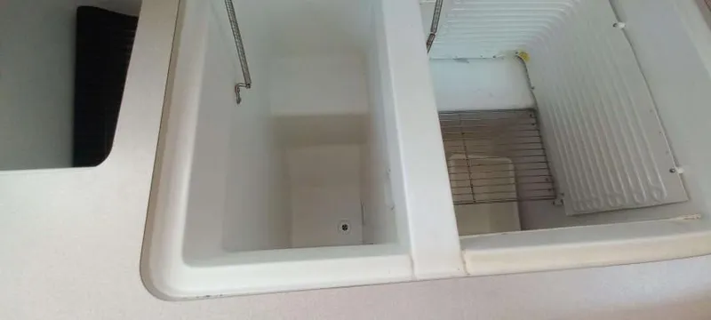 Happy Destiny Yacht Photos Pics Kitchen sink and storage area on 2004 Jeanneau Sun Odyssey 43 DS yacht.