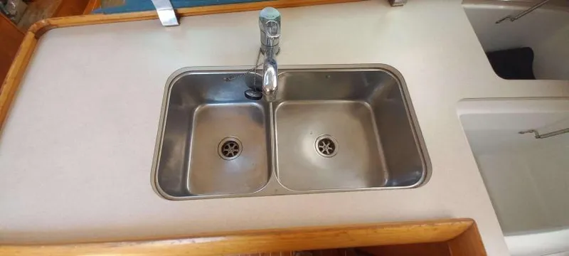 Happy Destiny Yacht Photos Pics Double stainless steel sink in 2004 Jeanneau Sun Odyssey 43 DS yacht kitchen.