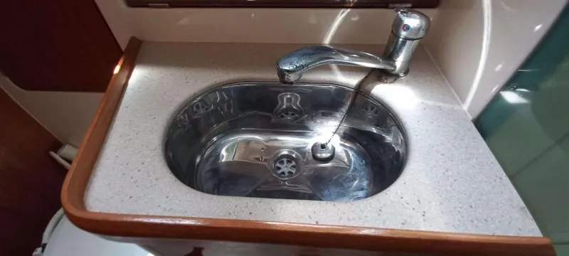 Happy Destiny Yacht Photos Pics Stainless steel sink in 2004 Jeanneau Sun Odyssey 43 DS yacht kitchen.