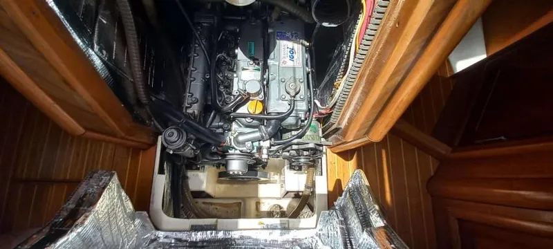 Happy Destiny Yacht Photos Pics Engine compartment of 2004 Jeanneau Sun Odyssey 43 DS sailboat, showcasing detailed mechanical components.