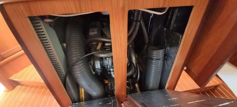 Happy Destiny Yacht Photos Pics Engine compartment of 2004 Jeanneau Sun Odyssey 43 DS sailboat, showcasing mechanical components.