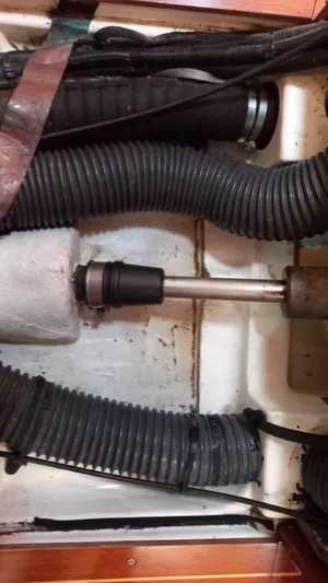 Happy Destiny Yacht Photos Pics Engine compartment of a 2004 Jeanneau Sun Odyssey 43 DS sailboat, showing hoses and mechanical components.