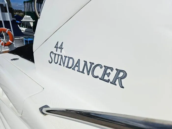  Yacht Photos Pics 2006 Sea Ray 44 Sundancer yacht, close-up of model name on hull.