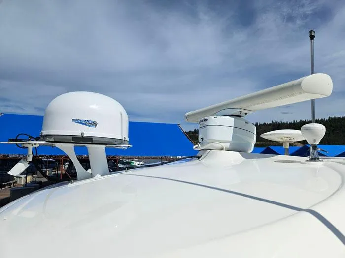  Yacht Photos Pics Radar and satellite equipment on 2006 Sea Ray 44 Sundancer yacht under blue sky.