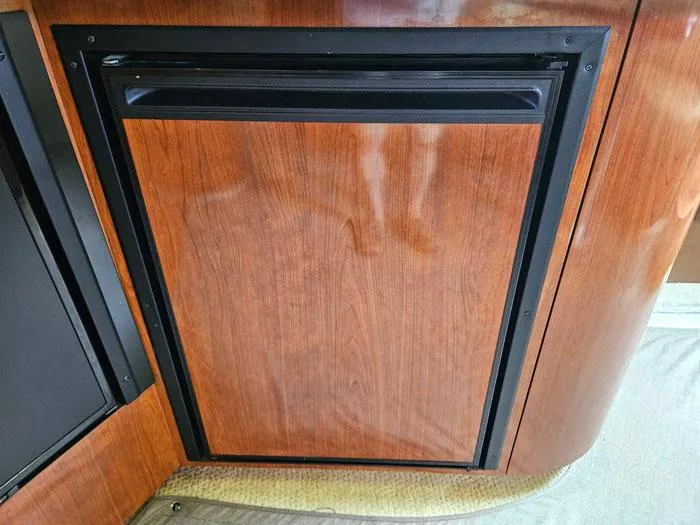  Yacht Photos Pics Wood-paneled cabinet door on 2006 Sea Ray 44 Sundancer yacht interior.