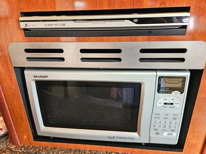  Yacht Photos Pics Sharp convection microwave and DVD player in 2006 Sea Ray 44 Sundancer yacht kitchen.