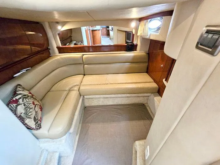  Yacht Photos Pics Interior of 2006 Sea Ray 44 Sundancer yacht with beige leather seating and wooden accents.