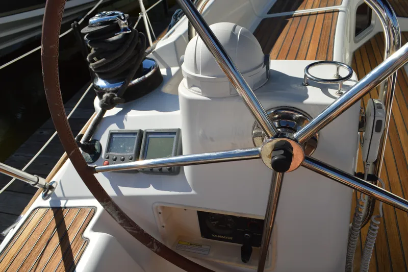 Down Time Yacht Photos Pics Steering wheel and controls of 2008 Jeanneau Sun Odyssey 45 DS sailboat.