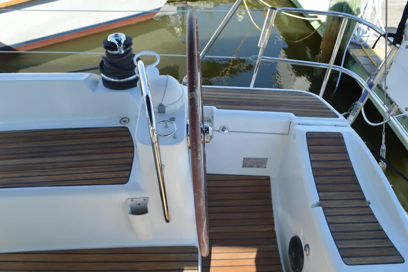Down Time Yacht Photos Pics Cockpit of 2008 Jeanneau Sun Odyssey 45 DS with wooden deck and steering wheel.