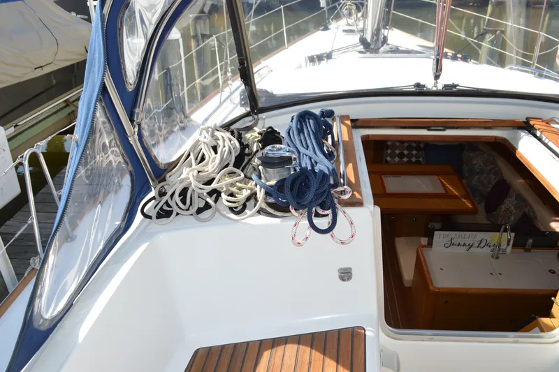 Down Time Yacht Photos Pics 2008 Jeanneau Sun Odyssey 45 DS sailboat deck with ropes and cabin entrance.
