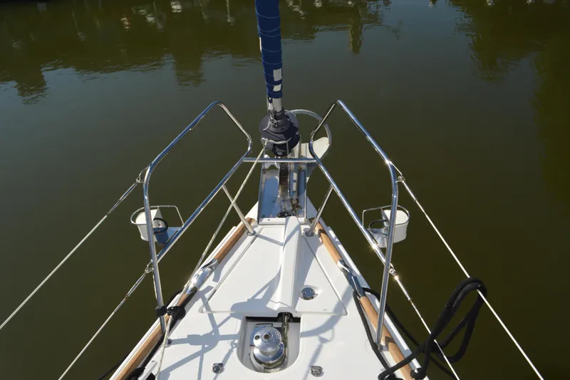 Down Time Yacht Photos Pics Bow view of 2008 Jeanneau Sun Odyssey 45 DS sailboat, featuring stainless steel railings.