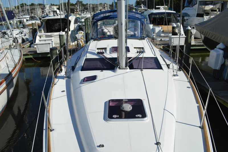 Down Time Yacht Photos Pics 2008 Jeanneau Sun Odyssey 45 DS sailboat docked at marina, showcasing sleek deck design.