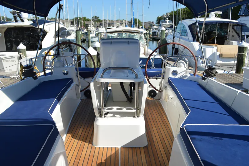 Down Time Yacht Photos Pics Cockpit view of 2008 Jeanneau Sun Odyssey 45 DS sailboat in marina.