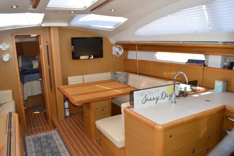 Down Time Yacht Photos Pics Interior of 2008 Jeanneau Sun Odyssey 45 DS yacht with modern wood finish.