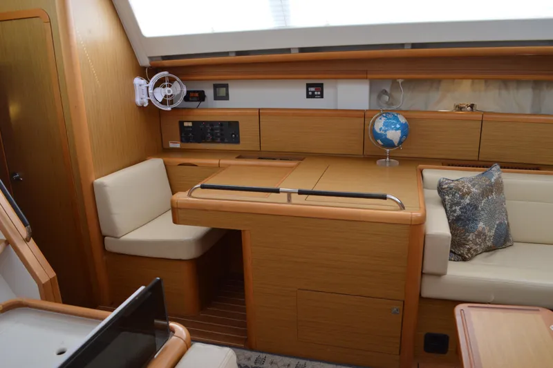 Down Time Yacht Photos Pics Interior of 2008 Jeanneau Sun Odyssey 45 DS yacht with seating and navigation area.