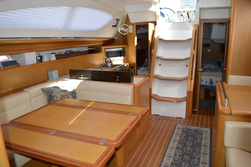 Down Time Yacht Photos Pics Luxurious interior of 2008 Jeanneau Sun Odyssey 45 DS sailboat with modern amenities.