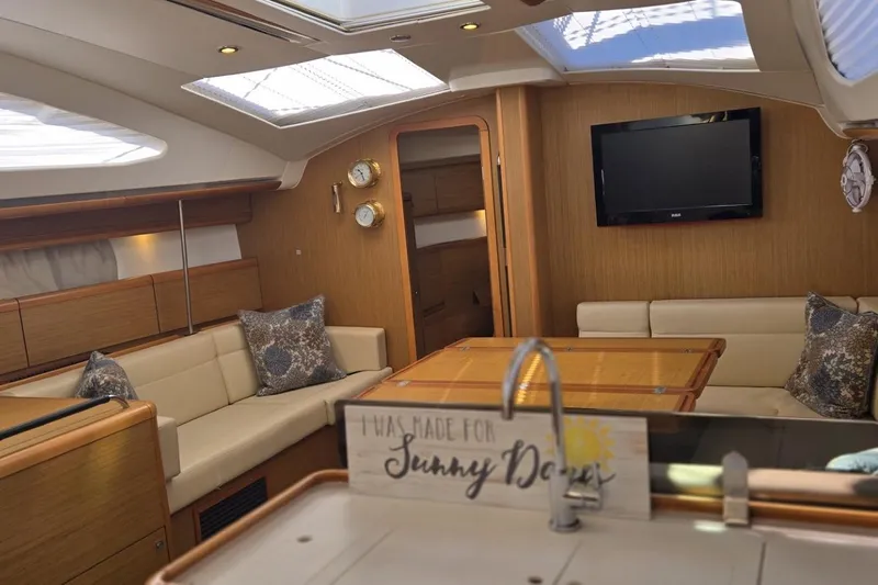 Down Time Yacht Photos Pics Luxurious interior of 2008 Jeanneau Sun Odyssey 45 DS yacht with elegant seating and decor.