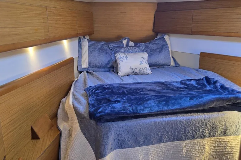 Down Time Yacht Photos Pics Luxurious cabin interior of 2008 Jeanneau Sun Odyssey 45 DS sailboat with cozy bedding.