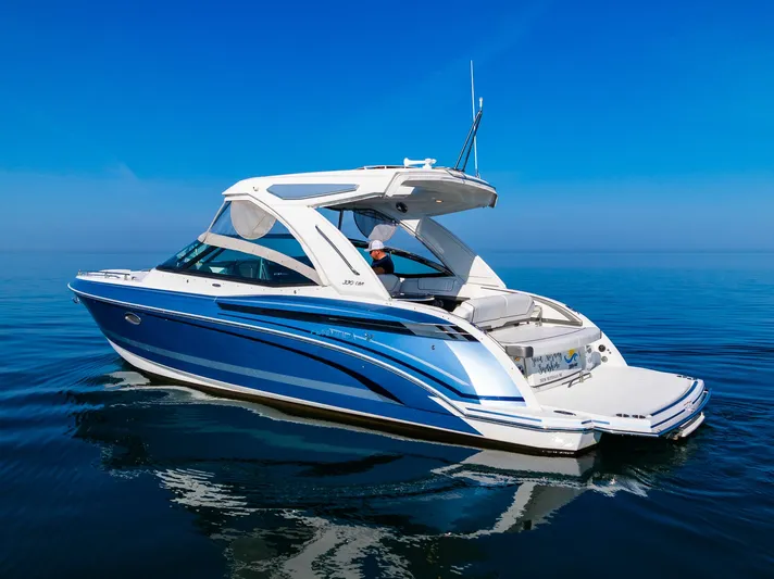 Good Morning Sunshine Yacht Photos Pics 2019 Formula 330 Crossover Bowrider on calm blue water, showcasing sleek design and luxury features.
