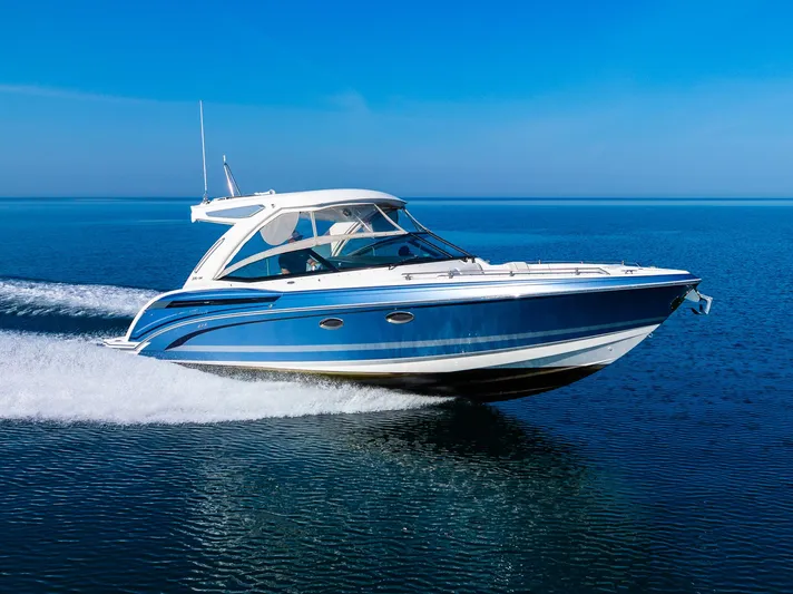 Good Morning Sunshine Yacht Photos Pics 2019 Formula 330 Crossover Bowrider cruising on clear blue water.