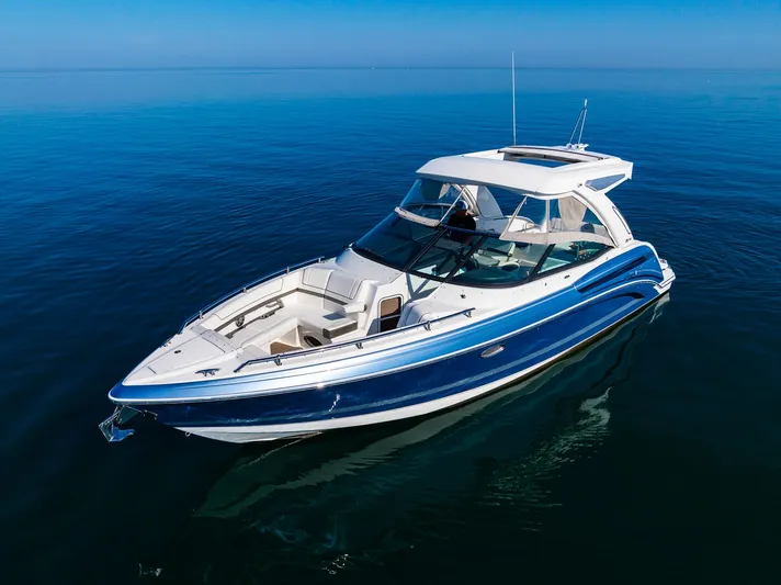 Good Morning Sunshine Yacht Photos Pics 2019 Formula 330 Crossover Bowrider on calm blue water, showcasing sleek design and luxury features.