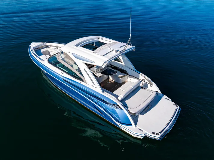 Good Morning Sunshine Yacht Photos Pics 2019 Formula 330 Crossover Bowrider on calm blue water, aerial view.