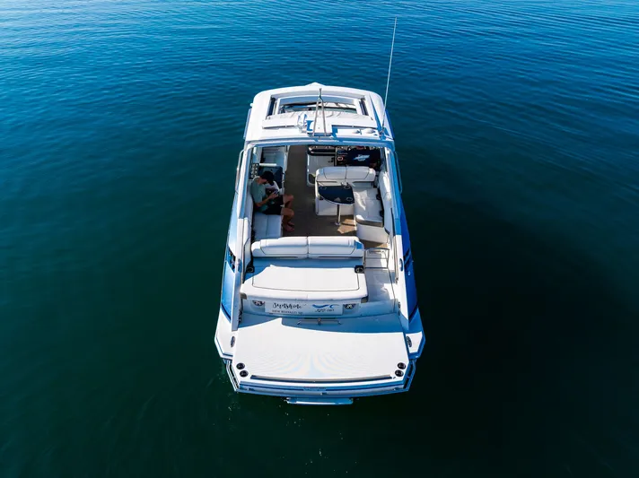 Good Morning Sunshine Yacht Photos Pics 2019 Formula 330 Crossover Bowrider on calm water, aerial view.