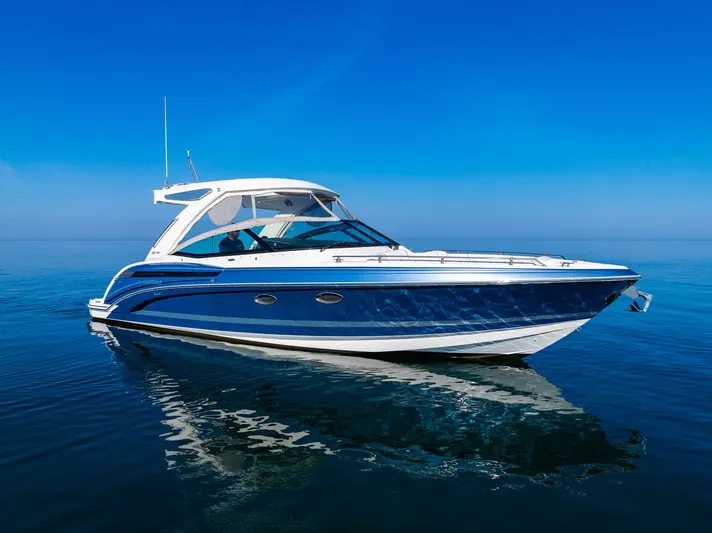 Good Morning Sunshine Yacht Photos Pics 2019 Formula 330 Crossover Bowrider on calm blue water under clear sky.
