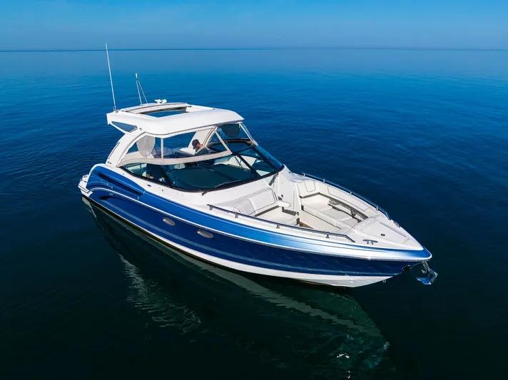Good Morning Sunshine Yacht Photos Pics 2019 Formula 330 Crossover Bowrider on calm blue water, showcasing sleek design.