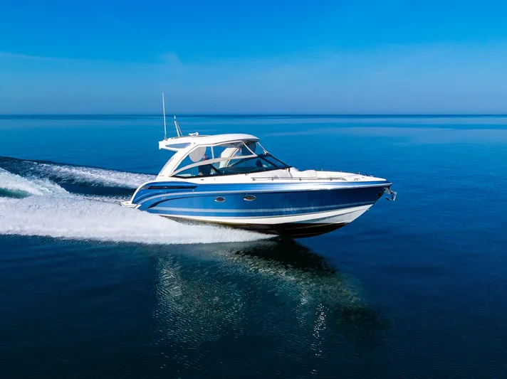 Good Morning Sunshine Yacht Photos Pics 2019 Formula 330 Crossover Bowrider cruising on open water, showcasing sleek design.