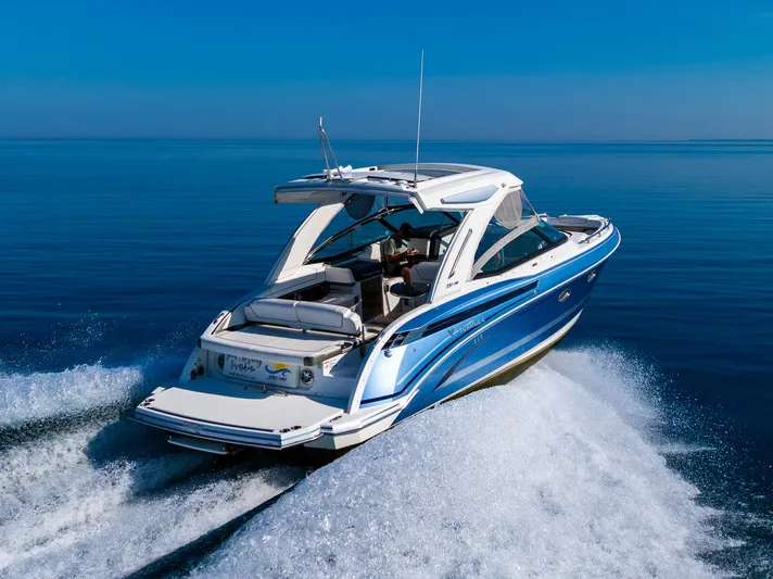 Good Morning Sunshine Yacht Photos Pics 2019 Formula 330 Crossover Bowrider cruising on open water, showcasing sleek design and performance.