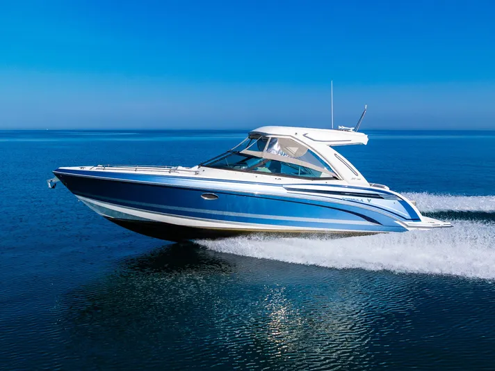 Good Morning Sunshine Yacht Photos Pics 2019 Formula 330 Crossover Bowrider cruising on open water under clear blue skies.
