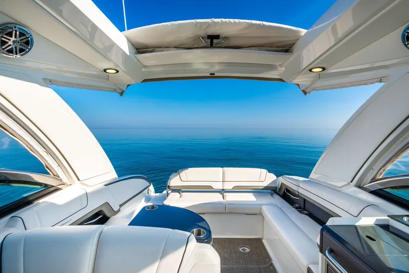 Good Morning Sunshine Yacht Photos Pics 2019 Formula 330 Crossover Bowrider interior with ocean view, featuring luxurious seating and open canopy.