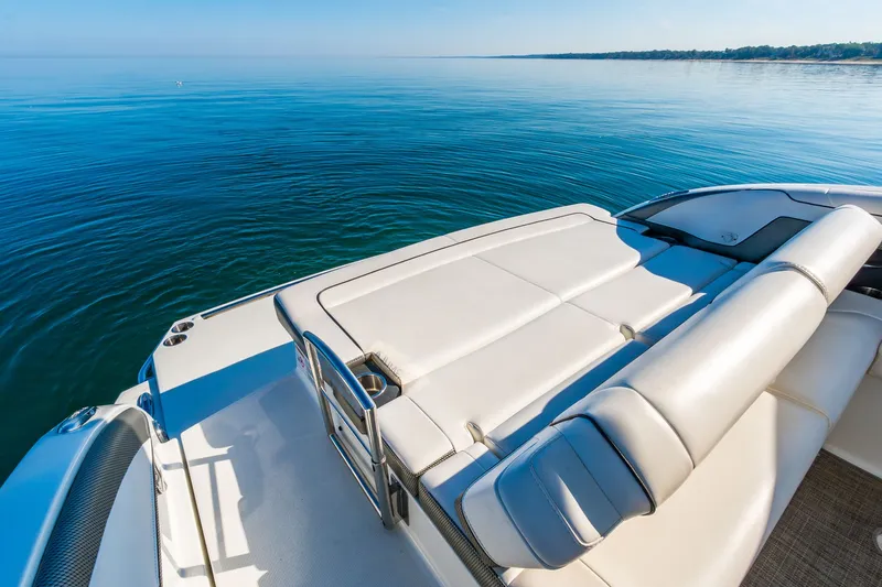 Good Morning Sunshine Yacht Photos Pics 2019 Formula 330 Crossover Bowrider on calm blue water, showcasing luxury seating.