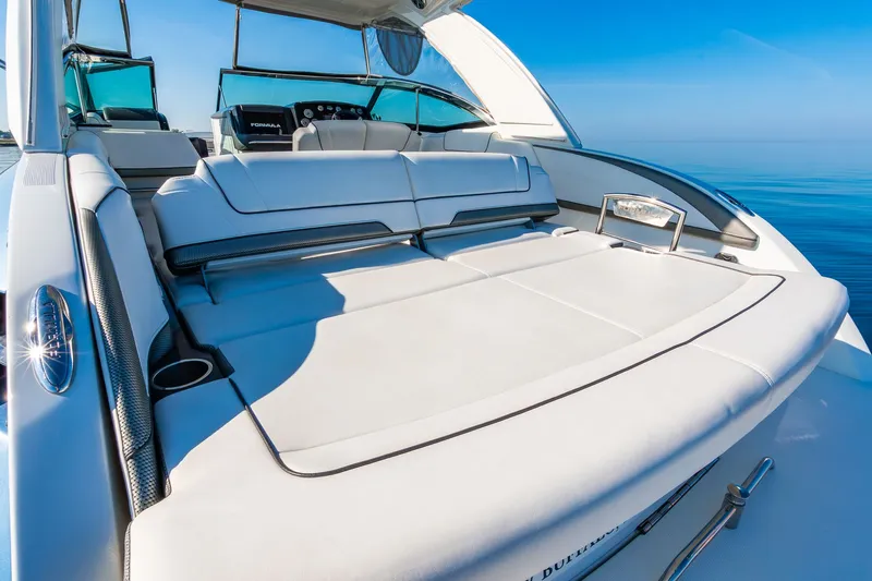 Good Morning Sunshine Yacht Photos Pics 2019 Formula 330 Crossover Bowrider with luxurious seating on calm blue waters.