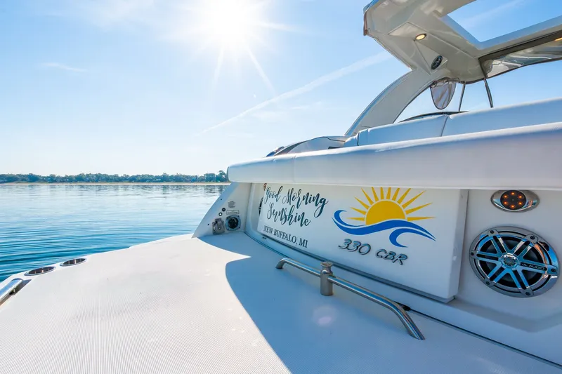 Good Morning Sunshine Yacht Photos Pics 2019 Formula 330 Crossover Bowrider on serene water under bright sun.