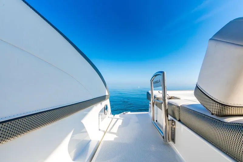 Good Morning Sunshine Yacht Photos Pics 2019 Formula 330 Crossover Bowrider on calm blue sea under clear sky.