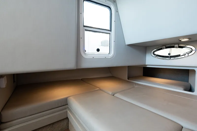 Good Morning Sunshine Yacht Photos Pics 2019 Formula 330 Crossover Bowrider cabin interior with cozy seating and windows.